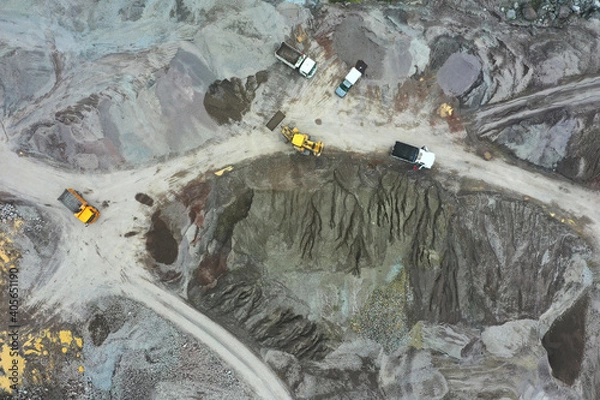 Fototapeta Large heavy machiney in a mine moving sand