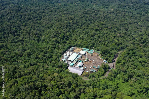 Fototapeta Top view, still video of an oil pumping platform in an oil field of the Amazon rainforest of South America
