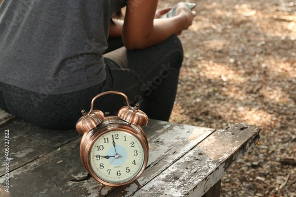 Fototapeta clock of waiting, a woman is waiting someting