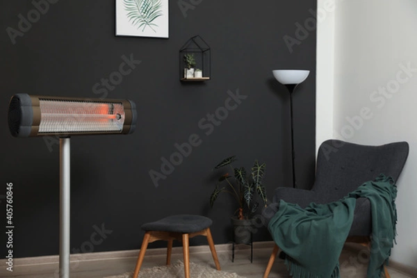 Fototapeta Modern electric infrared heater in room interior