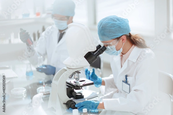Fototapeta laboratory technician conducts testing in the laboratory .