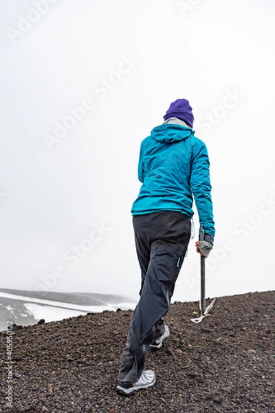 Obraz person walking on the mountain