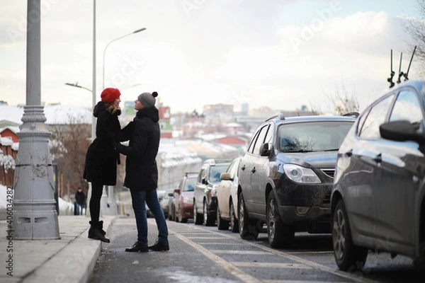 Obraz Young couple walking through the winter