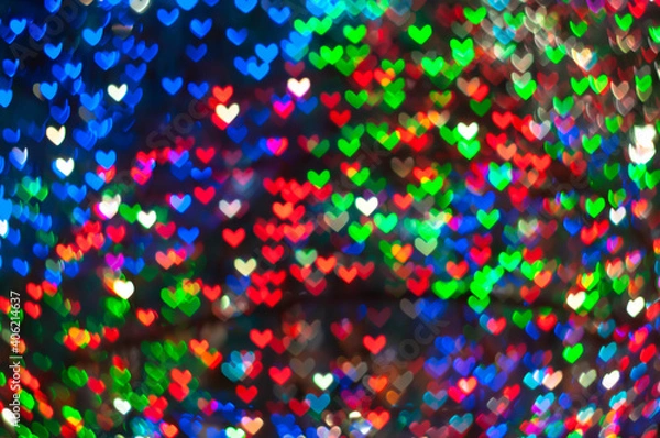 Fototapeta Color Bokeh on a dark background with hearts for use in graphic design