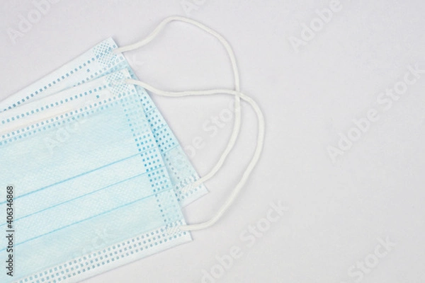 Obraz Antivirus mask, protection against coronavirus on a white background, preventing the spread of viruses and COVID-19 outbreaks