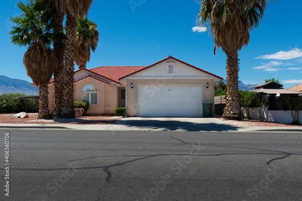 Fototapeta The facade of a residential house in a suburb area in the State of Nevada, USA.