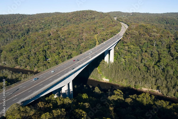Obraz Aerial view of the Pacific Motorway (M1) and the 74m high twin cantilever Mooney Mooney Creek Bridge.