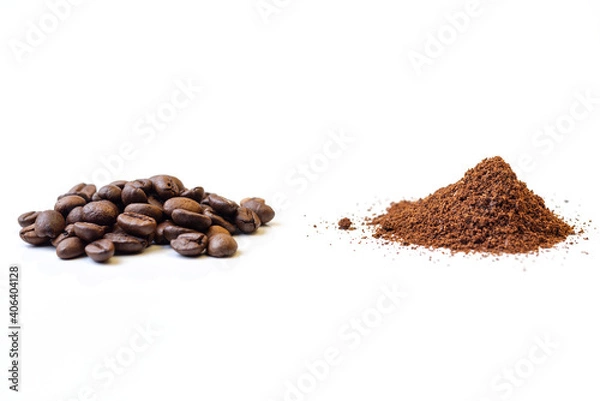 Fototapeta A pile of whole roasted coffee beans and another pile of grounded coffee on an isolated white background.