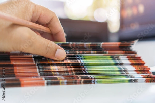 Fototapeta Pile of presentation brochure document concept : Businessman hands working in business Documents on Stacks Brochures papers files for checking achieves reports on busy work computer desk office