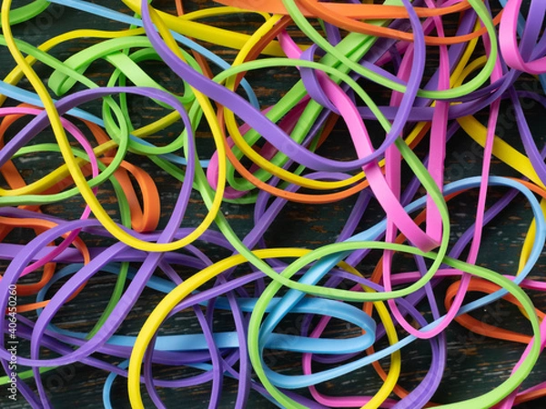 Fototapeta A tangled mess of colourful elastic bands