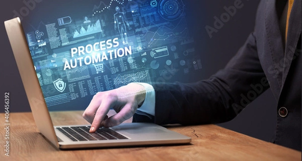 Fototapeta Businessman working on laptop with PROCESS AUTOMATION inscription, cyber technology concept