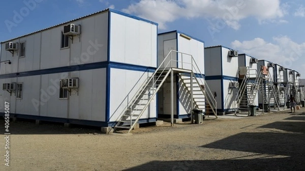 Fototapeta Portacabin, porta cabin, temporary labours camp , Mobile building in industrial site or office container Portable house and office cabins. Labor Camp. Porta cabin. small temporary houses