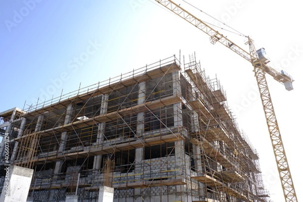 Obraz building under construction with tower crane