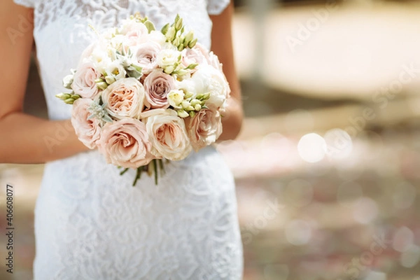 Obraz bride holding a bouquet of flowers