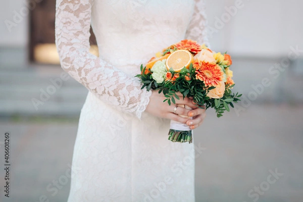 Obraz wedding bouquet with oranges in the hands