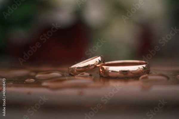 Obraz Rings just married on a wet table