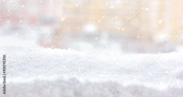 Fototapeta Winter snow background. A view from a window after a snowfall. Snow drifts in a city