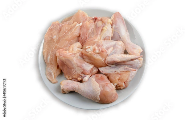 Fototapeta Raw chicken meat on a plate. Isolated on a white background.The view from the top. Healthy eating