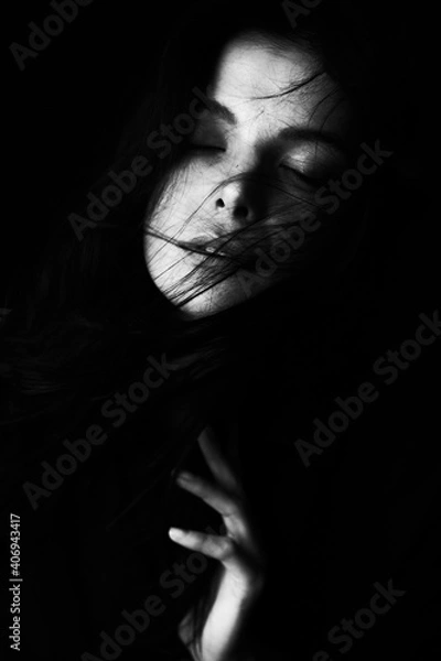 Obraz Emotional Sensual black and white portrait of a beautiful girl on a dark background