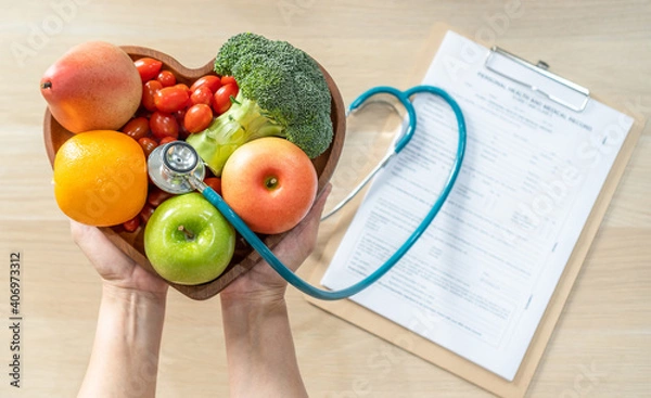 Fototapeta Nutritional food for heart health wellness by cholesterol diet and healthy nutrition eating with clean fruits and vegetables in heart dish by nutritionist and doctor recommended for patient well-being