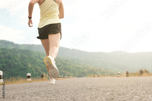 Obraz Empty road with running girl in background