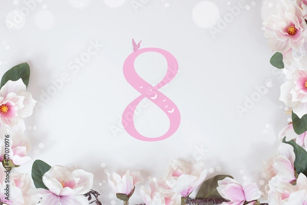 Fototapeta Magnolia branch on a white background. postcard March 8, Mother's Day, happy Birthday. space for text.