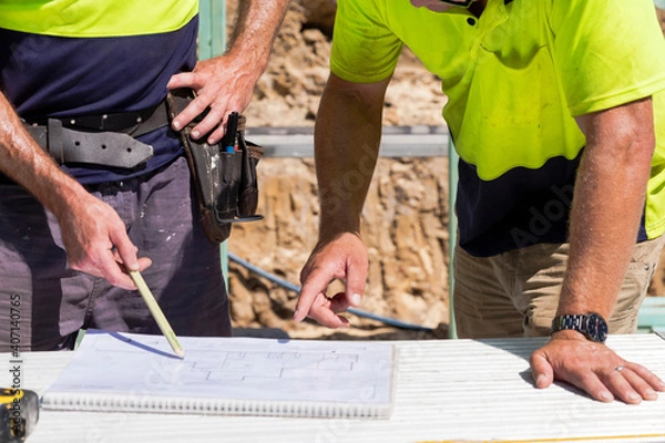 Obraz Builders with plans