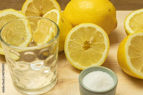 Fototapeta lemons over a brown table