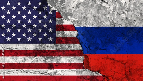 Fototapeta Concept of a Conflict between the United States of America and Russia with painted flags on a wall with a crack