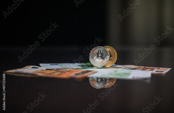 Obraz Cryptocurrency bitcoin. Money and bitcoin. Bitcoin is a close plan. Euro banknotes