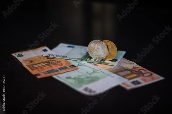 Obraz Cryptocurrency bitcoin. Money and bitcoin. Bitcoin is a close plan. Euro banknotes