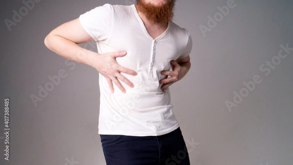 Fototapeta young handsome man feeling pain