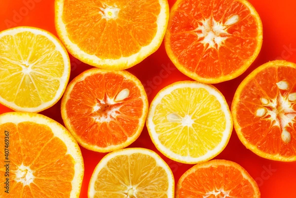 Fototapeta Background composition with citrus fruits on red background, flat lay. High quality photo