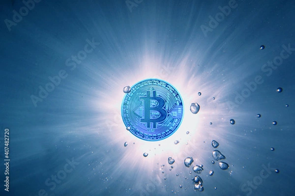 Fototapeta blue bitcoin instead a sun view from underwater with bubbles