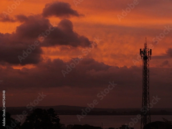 Obraz sunset over the city and texture clouds