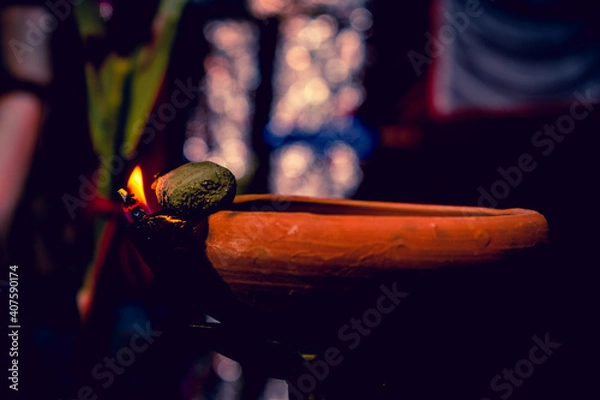 Obraz Creative Photography of A Realistic Burning Mud Oil Lamps in Diwali, An Indian Festival in Evening. Colorful Red, Yellow, Orange Fire Flame Lit on Dark Night Shadow Background with Noise Grain Effect.