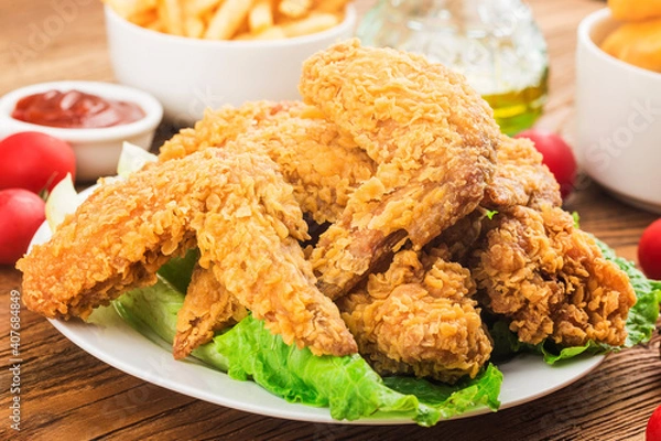 Fototapeta fried chicken wings wooden table