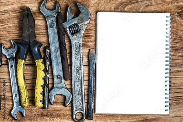 Fototapeta various tools blank notebook wooden background (1)