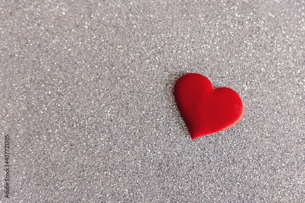 Fototapeta Red heart on a grey sparkle background. Minimal concept for Valentine day.
