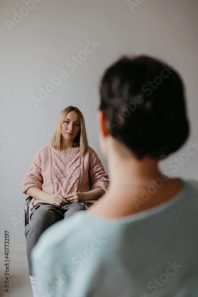 Fototapeta dialogue between two women in the room