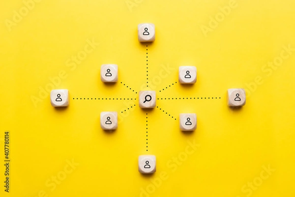 Fototapeta Concept selection and research workers with a magnifying glass on an abstract and employees