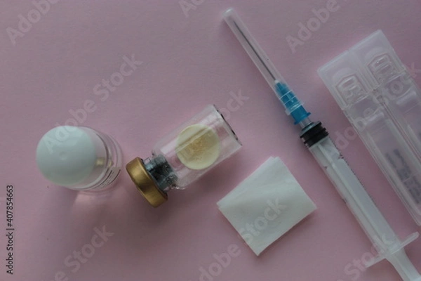 Fototapeta The dry vaccine is in a vial, a diluent and a syringe for injection.