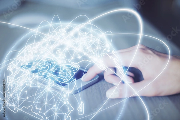 Fototapeta Double exposure of business theme sketch hologram and woman holding and using a mobile device.