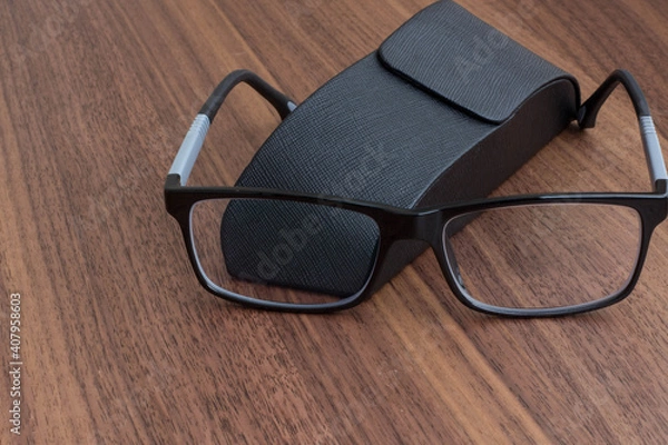 Obraz black glasses with case
