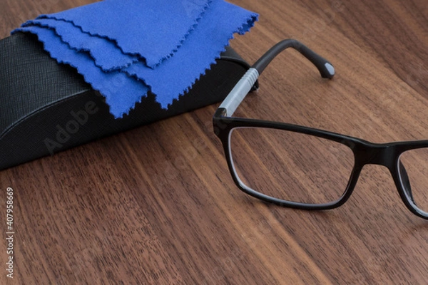 Obraz black glasses on a wooden table
