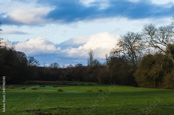 Obraz Clouds over a rural field 