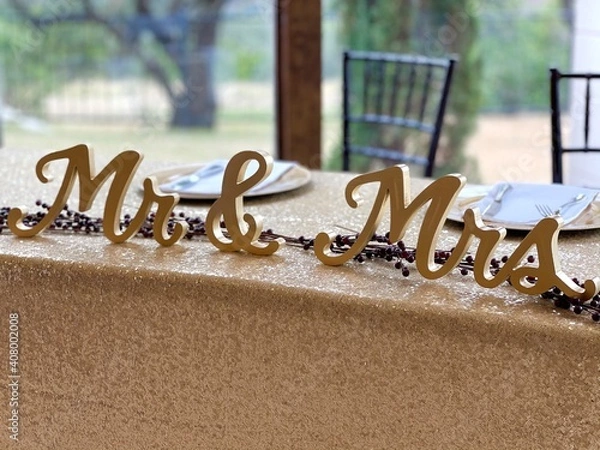 Obraz Mr and Mrs  signs at bride and groom table at wedding
