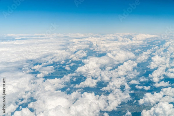 Fototapeta Sun rays in the cloudy sky.