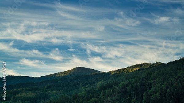 Fototapeta Germany, Black Forest Schwarzwald view above wide green forest mountains and mystical atmosphere early in the morning at sunrise