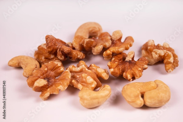 Fototapeta cashews and peeled walnuts mixed